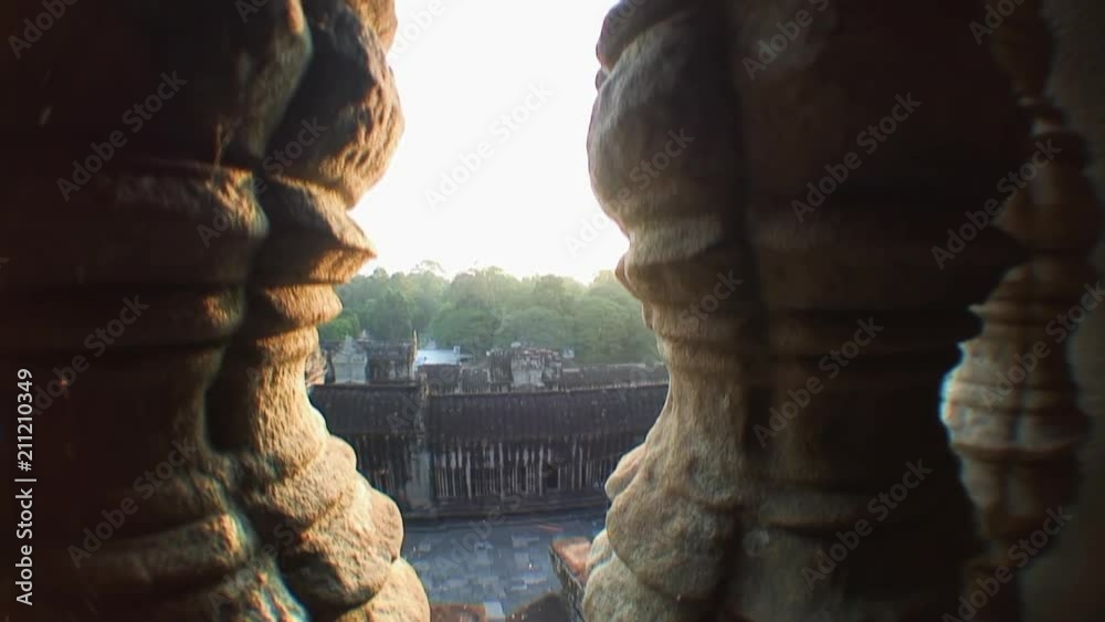 Peering Through Stone Pillars at Angkor Wat Peering Through Stone Pillars at Angkor Wat