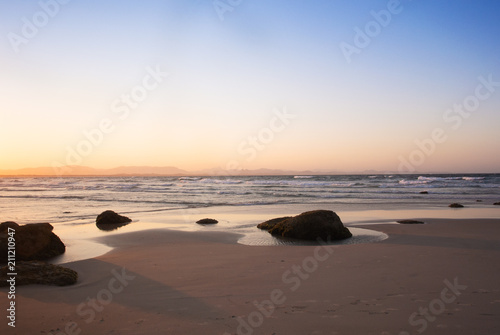 The pinky sunset on the deserted beach in Byron Bay, Australia © purmakdesigns