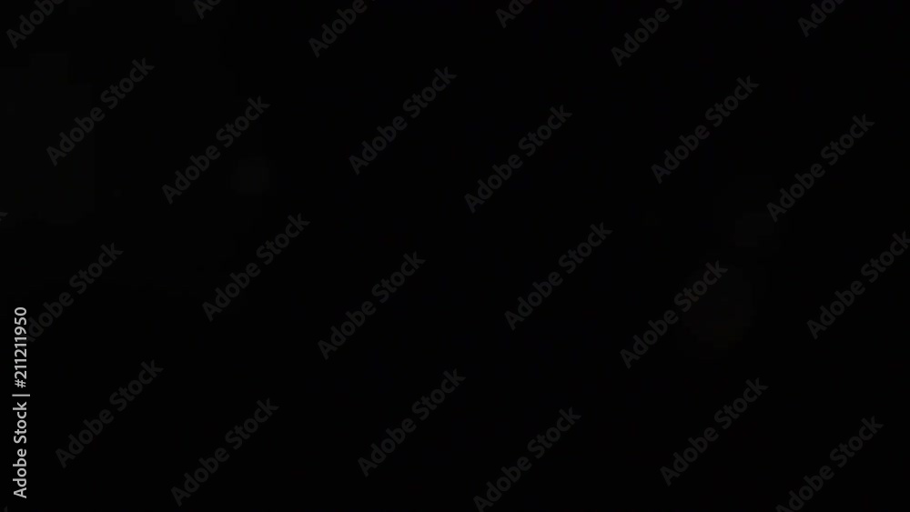 dust particle motion. abstract floating of bokeh blurred defocused round specks. snow storm movement on black background dust particle motion. abstract floating of bokeh blurred defocused round specks. snow storm movement on black background
