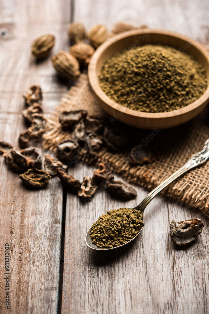 Indian ayurvedic Triphala churan or trifala powder is an ancient medicine for bowel movement or indigestion problems. Selective focus Indian ayurvedic Triphala churan or trifala powder is an ancient medicine for bowel movement or indigestion problems. Selective focus