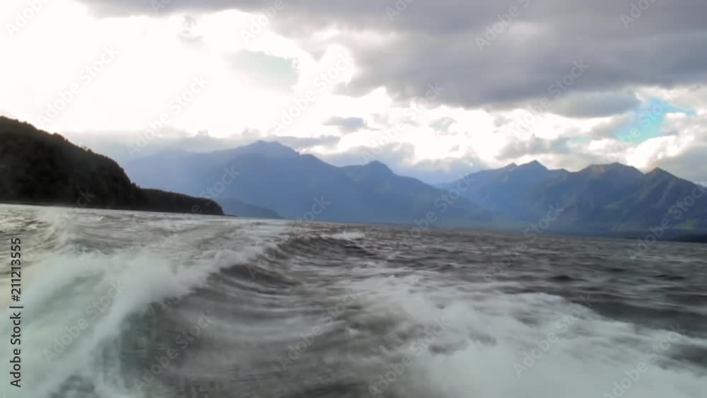 Wake Trailing behind a Large Speeding Boat Wake Trailing behind a Large Speeding Boat