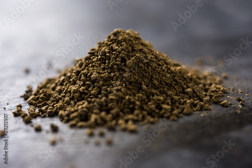 Indian ayurvedic Triphala churan or trifala powder is an ancient medicine for bowel movement or indigestion problems. Selective focus photo