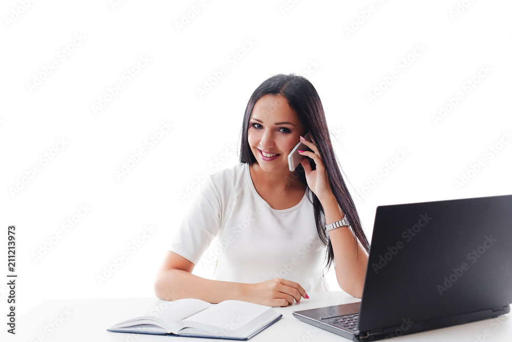Business woman talking on phone and works on laptop. Friendly an Business woman talking on phone and works on laptop. Friendly an