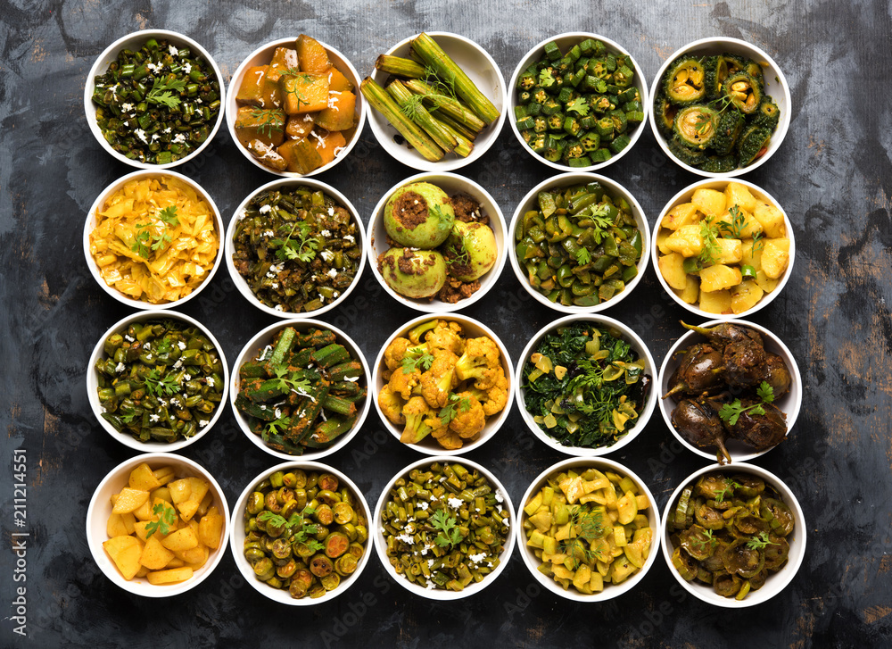 Indian sabzi / vegetable fried recipes served in white bowl over moody or colourful background. selective focus