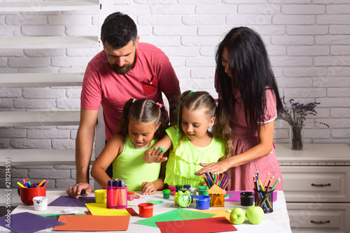 Girls drawing with mother and father