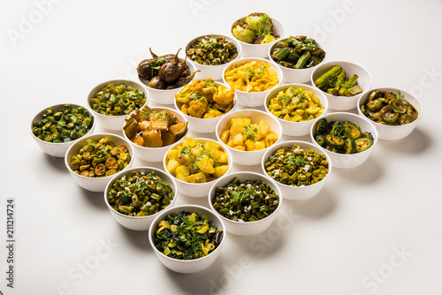 Indian sabzi / vegetable fried recipes served in white bowl over moody or colourful background. selective focus