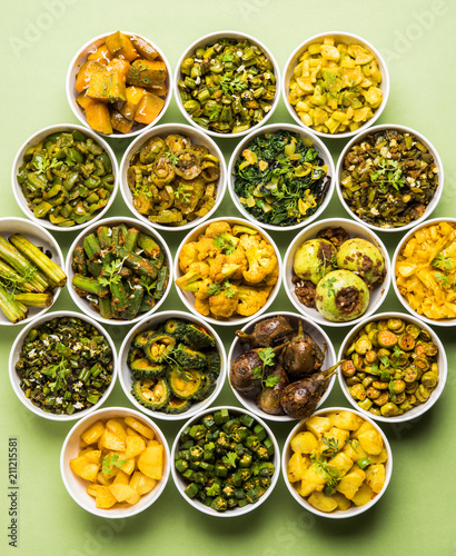 Indian sabzi / vegetable fried recipes served in white bowl over moody or colourful background. selective focus