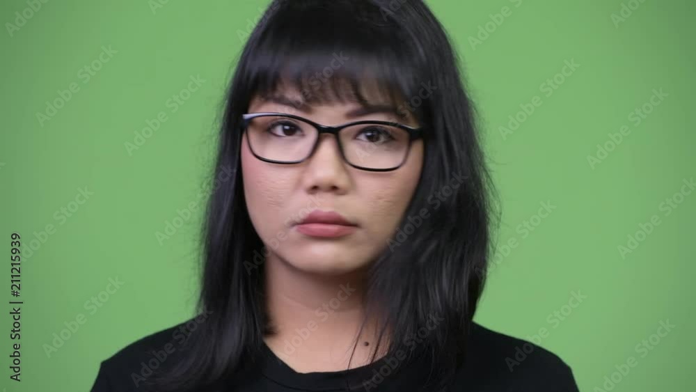 Beautiful Asian businesswoman nodding head no Beautiful Asian businesswoman nodding head no