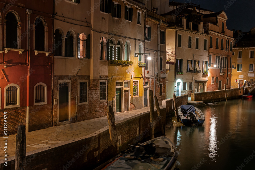Night view of canal in Venice, Italy. Architecture and landmarks of Venice. Night life of Venice. Venice postcard with night canal