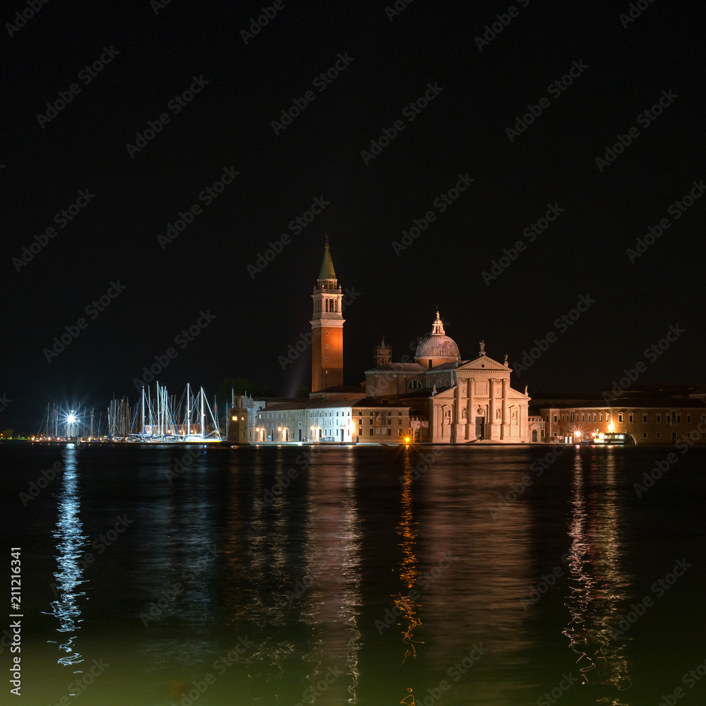 Night shot of church San Giorgio Maggiore by Andrea Palladio at Venice. Italy. The church is reflected in the water