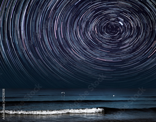 a star trail photography with Polaris over a sea