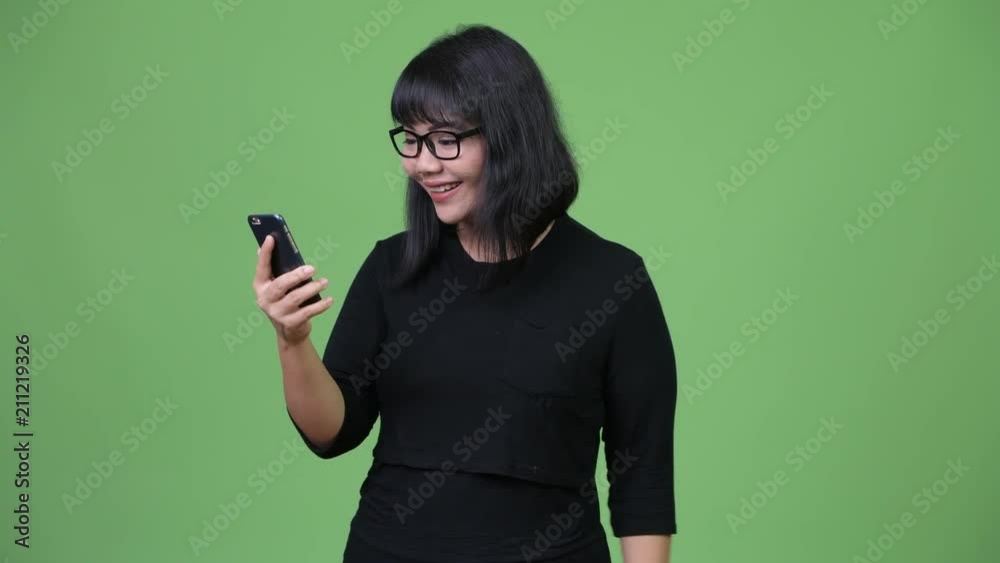 Beautiful Asian businesswoman using phone Beautiful Asian businesswoman using phone