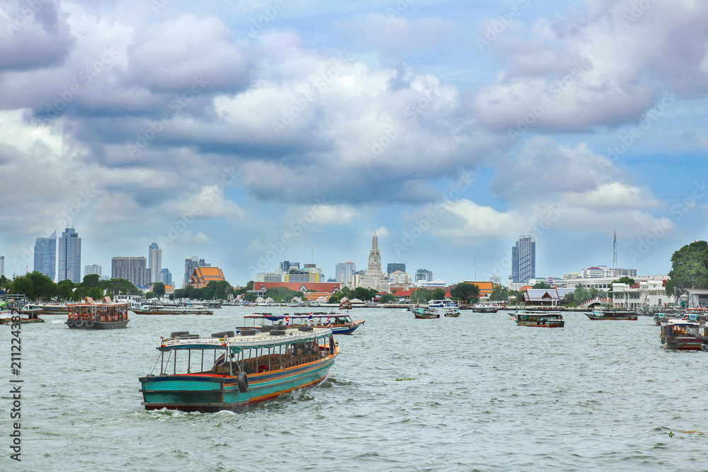 Boats on Chao Phraya river with cloudy sky ,Bangkok,Thailand