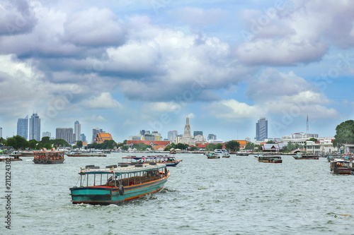 Boats on Chao Phraya river with cloudy sky ,Bangkok,Thailand