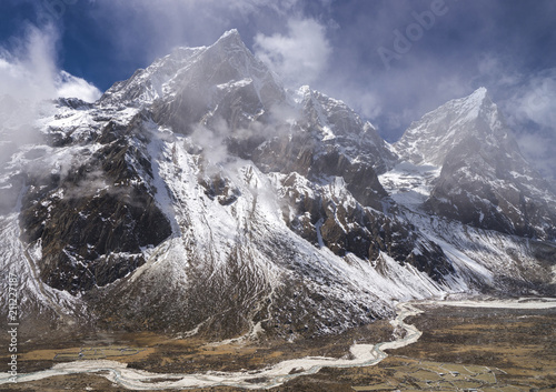 Taboche and Cholatse summits over Pheriche valley in Himalayas photo