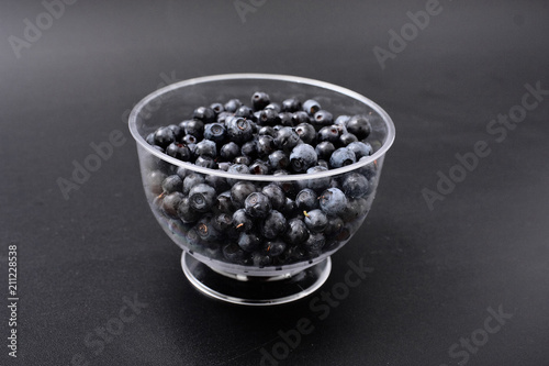 forest berry blueberry on a black background.