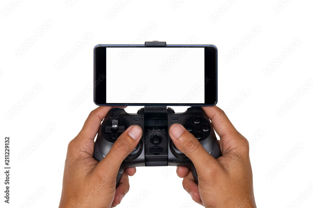 Hands of a man holding the joystick for playing games with a mobile phone isolated on white background with clipping path. Hands of a man holding the joystick for playing games with a mobile phone isolated on white background with clipping path.