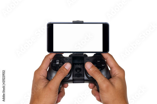 Hands of a man holding the joystick for playing games with a mobile phone isolated on white background with clipping path.