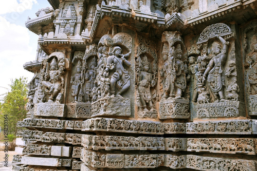 Ornate bas relieif and sculptures of Hindu deities, Kedareshwara Temple, Halebid, Karnataka photo