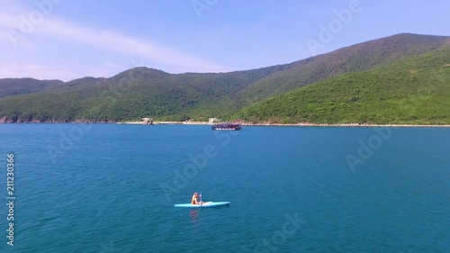  the girl swims on a kayak