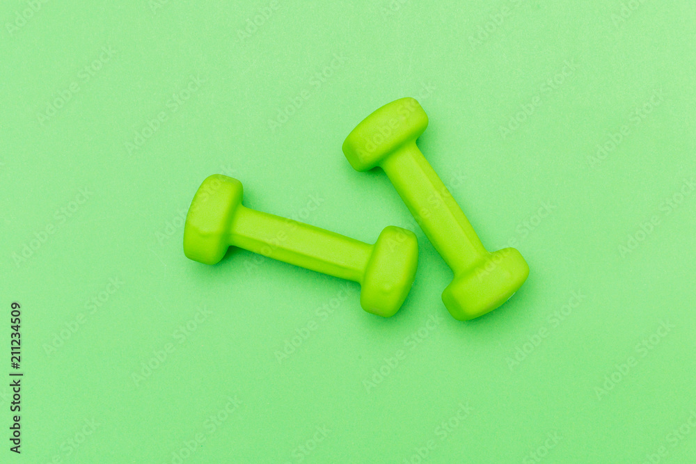 dumbbells on a color background dumbbells on a color background
