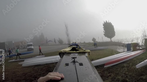 kayaking K4 getting on the water with the perfect view of foggy lake in Portugal photo