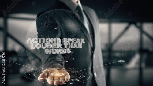 Actions speak louder than words with hologram businessman concept photo