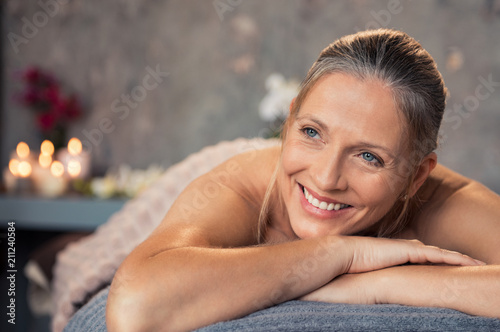 Mature woman smiling at spa