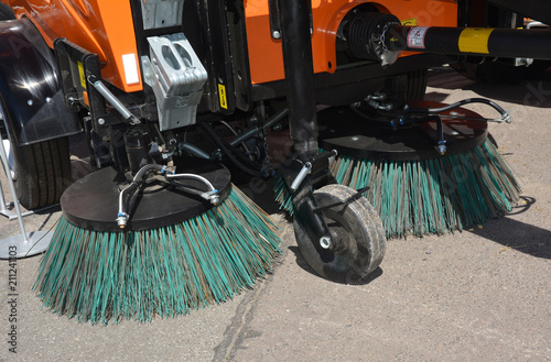 Street sweeper machine fow washing and cleaning asphalt road. Street cleaning. photo