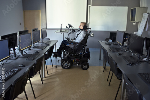 Disabled student in class room.