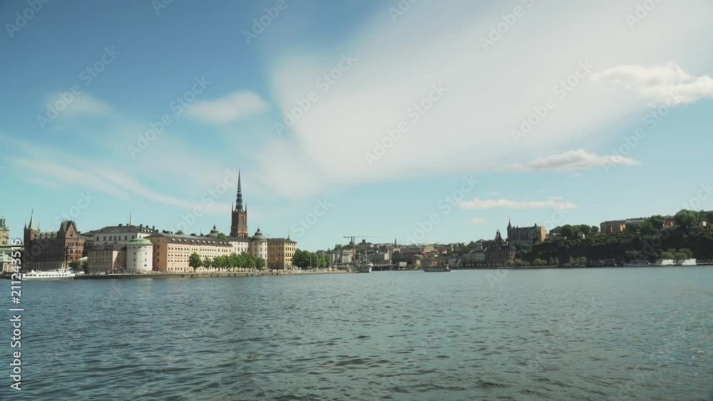 Static shot of Stockholms south side, looking from the City hall over the water. A warm summer day with warm weather, cloudy sky but blue sky. Static shot of Stockholms south side, looking from the City hall over the water. A warm summer day with warm weather, cloudy sky but blue sky.