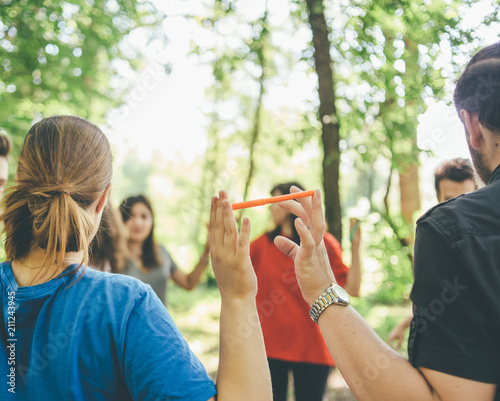 teambuilding exercises people stand in round holding hands