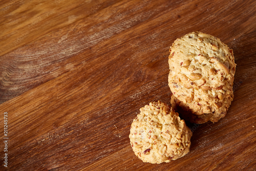 Bunch of chocolate biscuits on a rustic wooden background, close-up, selective focus. Bunch of chocolate biscuits on a rustic wooden background, close-up, selective focus.