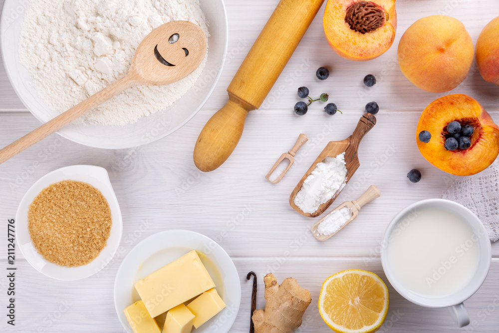 Ingredients for baking fruit pie on white table. Top view. Ingredients for baking fruit pie on white table. Top view.