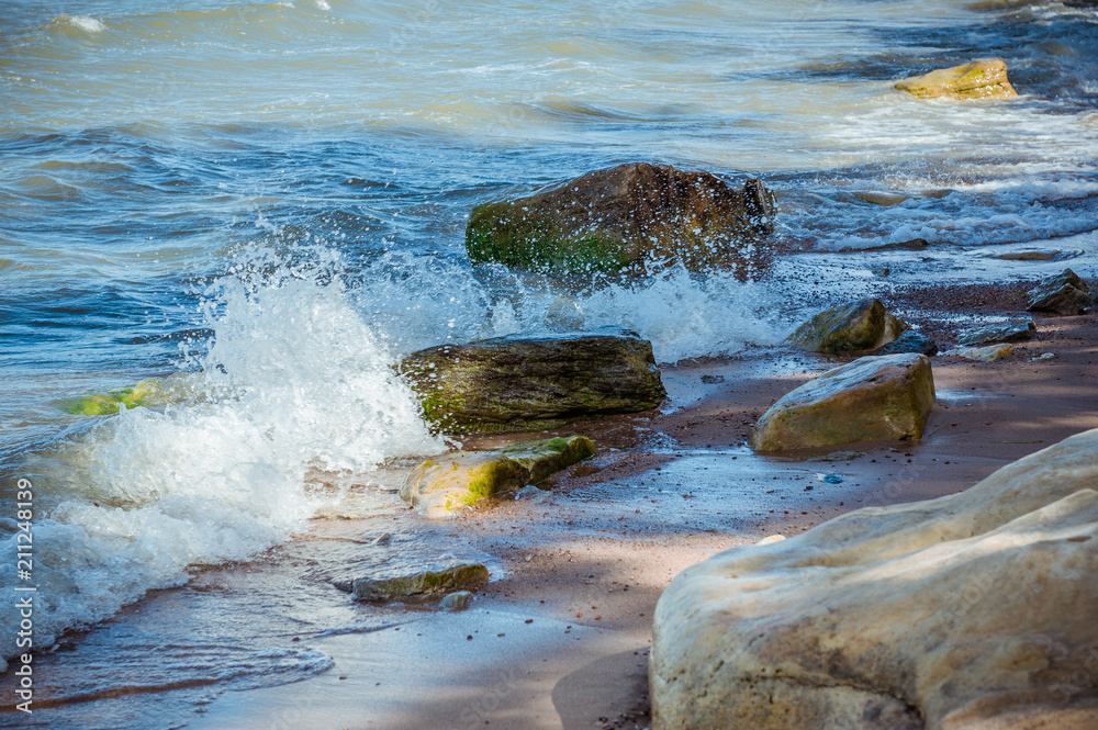 Naklejka premium Seascape with rocky beach and crashing waves. Baltic sea. The Gulf of Finland, Estonia.