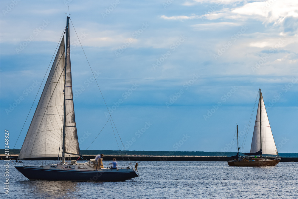 Blue sailboat at river