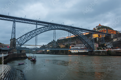 View of the Douro River and the iconic Dom Luis Bridge from the Ribeira neighbourhood in Porto, Portugal