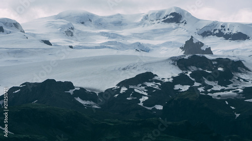glacier in iceland on a mountain covered in clouds