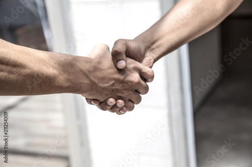Concept two coworkers handshaking
