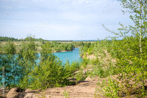 Photo of picturesque hilly terrain and blue lake