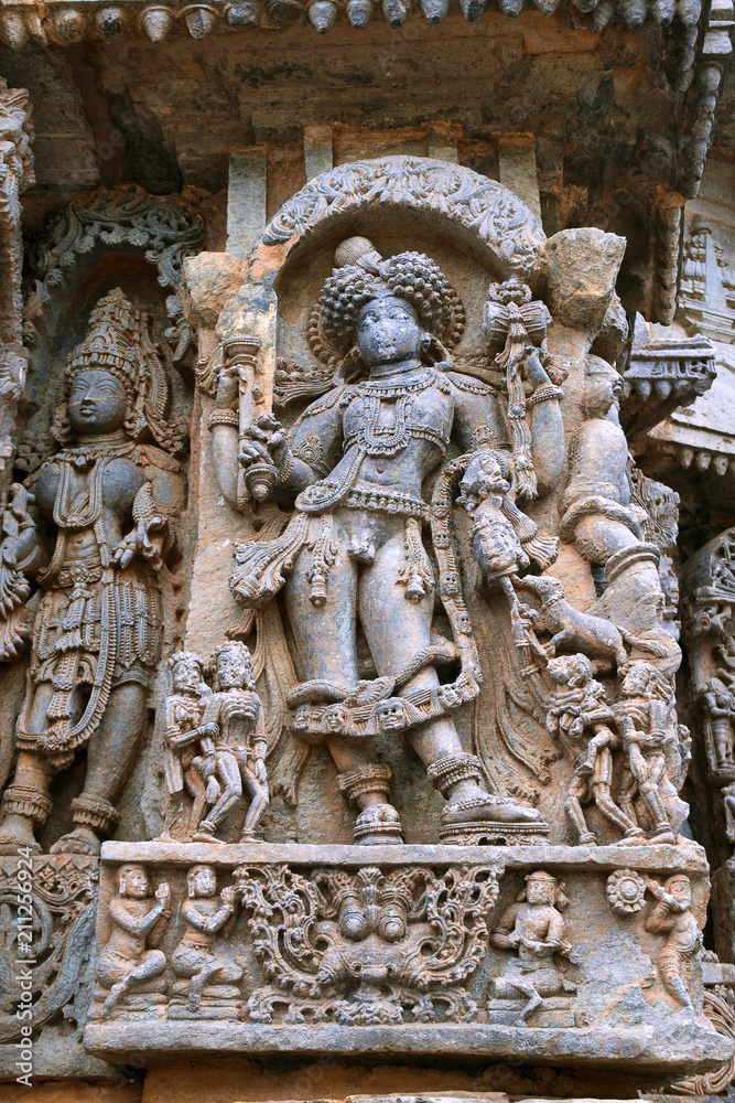 Ornate wall panel reliefs depicting Bhairava, a form of Shiva, Kedareshwara temple, Halebidu, Karnataka