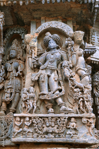 Ornate wall panel reliefs depicting Bhairava  a form of Shiva  Kedareshwara temple  Halebidu  Karnataka