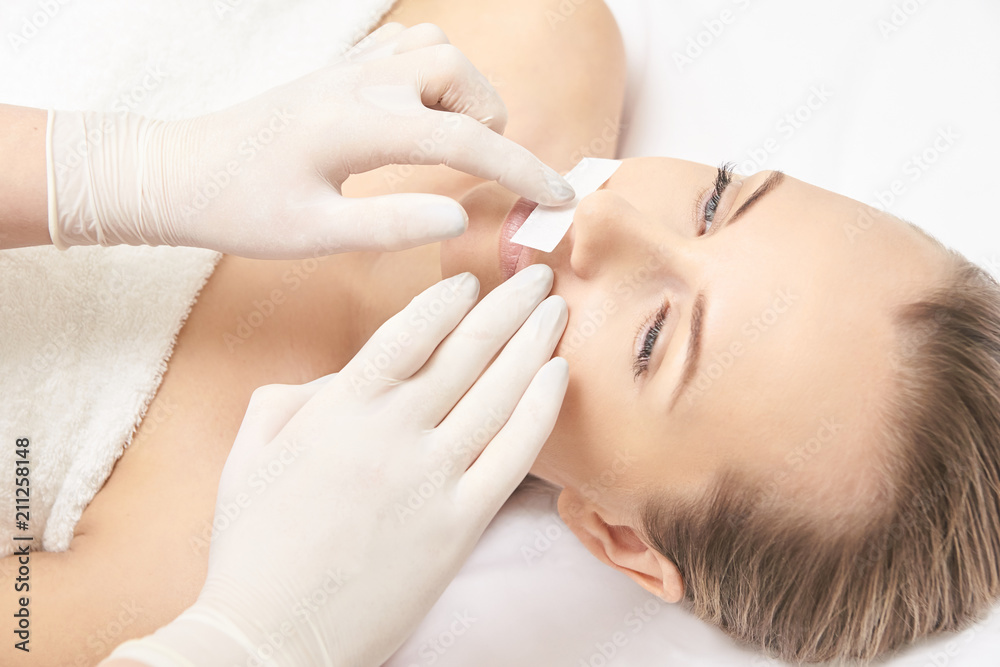 Sugar hair removal from woman body. Wax epilation spa procedure. Procedure beautician female. Mustache