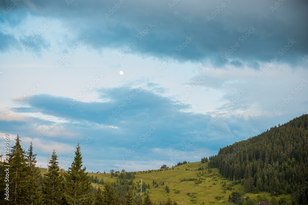 Nice mountains view at sunny day with under blue sky with sunlight at warm time. Carpathian mountains summer sunset landscape with sun and alpine pines Nice mountains view at sunny day with under blue sky with sunlight at warm time. Carpathian mountains summer sunset landscape with sun and alpine pines