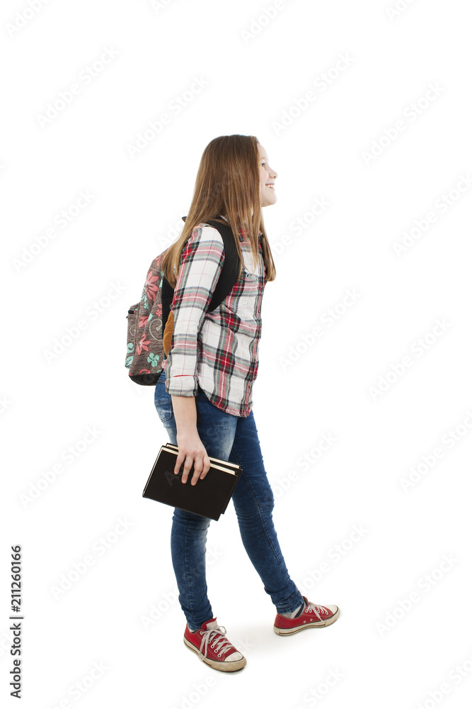 Young happy student with school bag and books, looking on copy space. Isolated on white background Young happy student with school bag and books, looking on copy space. Isolated on white background