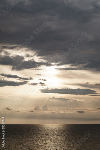 golden dark sunset and clouds over the sea