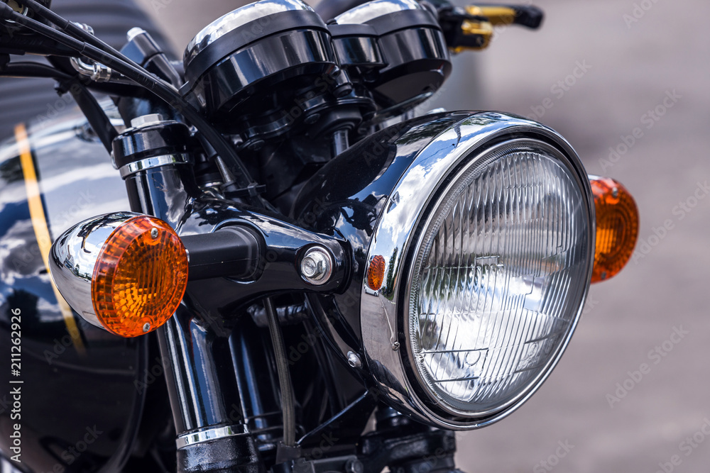 Front headlights and orange turn signals black-motorcycle