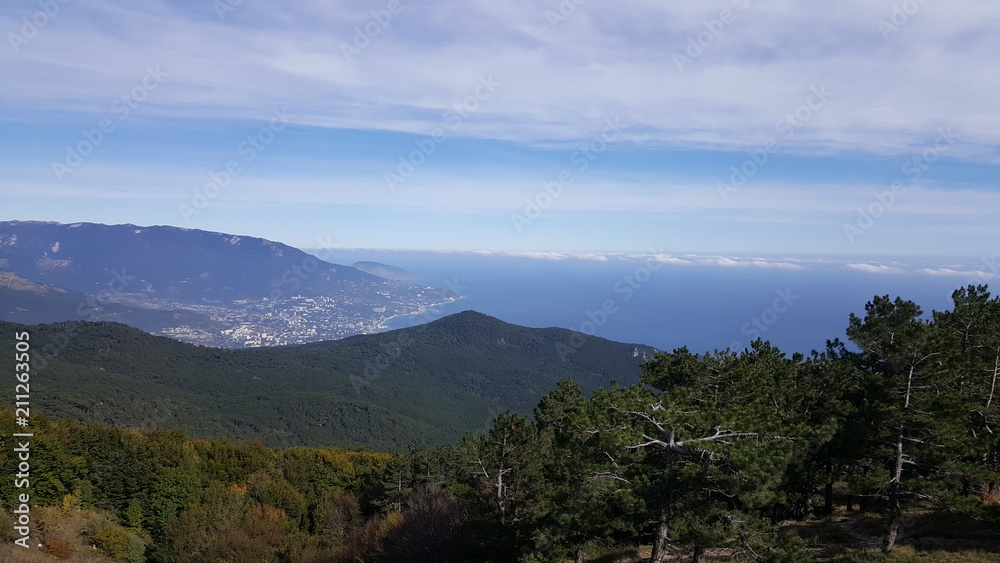 Beautiful view of the sea and mountains from the mountain forest Beautiful view of the sea and mountains from the mountain forest
