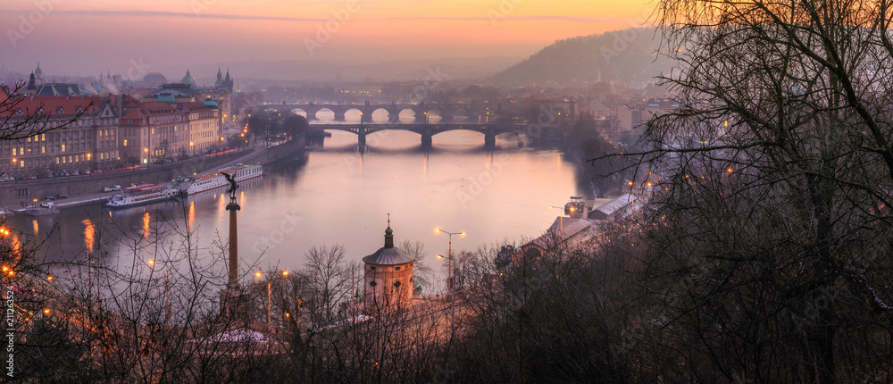 View at The Charles Bridge and Vltava river in Prague in dusk at sunset