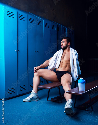 handsome muscular athletic man with a towel